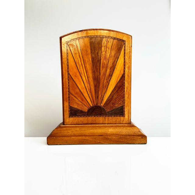 Handcrafted pair of Art Deco bookends from the 1930s with geometric sunburst marquetry. Made from contrasting wood veneers...