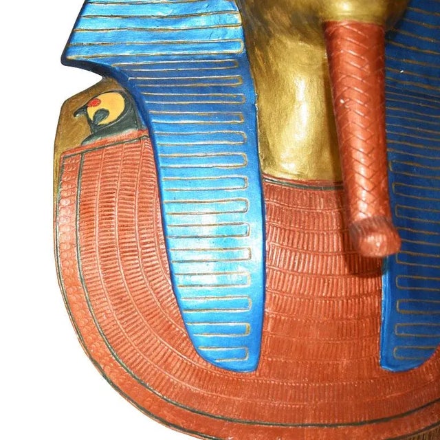 A handmade plaster but of the Egyptian King Tutankhamun. This lovely wall hanging will be an interesting addition to any...
