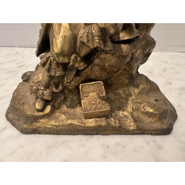 A detailed antique bronze sculpture of an artist posing with his palette and box of paints. French; was most likely an...