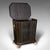 This is an antique fireside store. An English, ebonised pine and brass coal or log bin in Aesthetic Period taste, dating...
