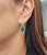 Elegant emerald and diamond earrings featuring 2 natural emeralds totaling 6.22 ct, beautifully complemented by 0.74 ct of...