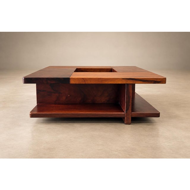 Made by Casa Finland in 1960s Brazil, this square coffee table gives flowers a place within the architecture of the piece....