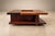 Made by Casa Finland in 1960s Brazil, this square coffee table gives flowers a place within the architecture of the piece....