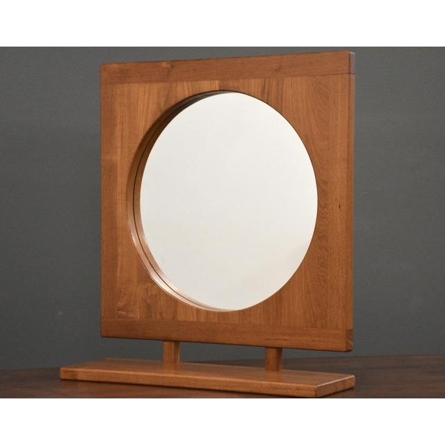 A mid century modern teak hanging mirror with a lower shelf made by Pedersen & Hansen. Made in Denmark. Circa 1970’s....