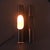 The magic of indirect light brushed silver aluminum tubes, white enamel interior, and black painted iron wall brackets...