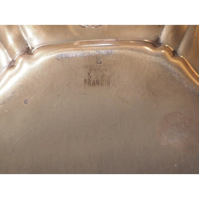 First produced in 1907 by the American silversmith company, Reed & Barton, this pair of sterling silver platters has...