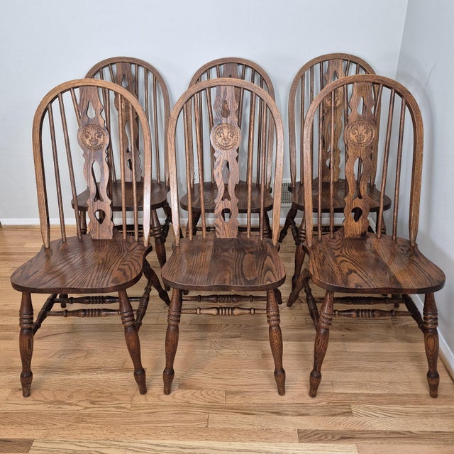This is a heirloom quality set of 6 solid oak windsor dining chairs signed by American chairmaker H.W. Hull & Sons of...