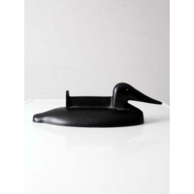 This antique cast iron duck boot scraper dates to the late 19th to early 20th century and reflects classic American folk...