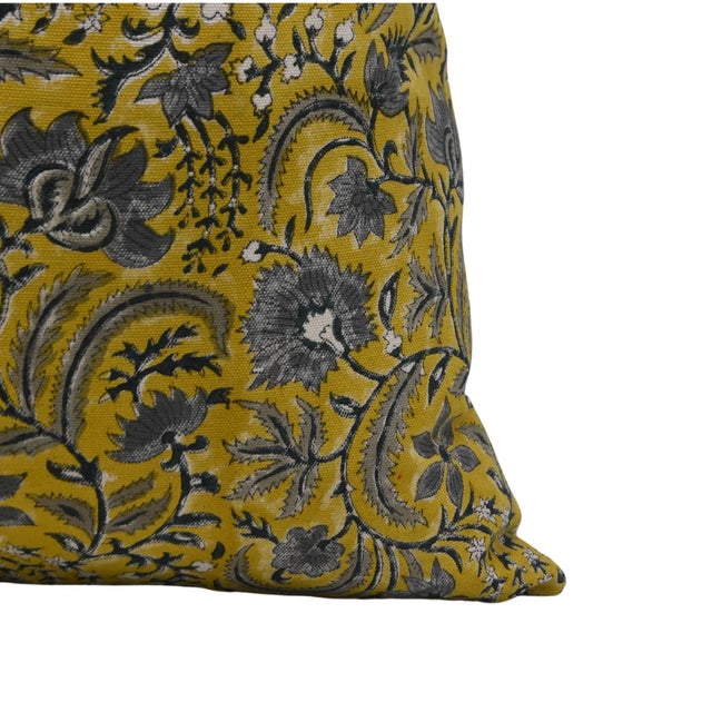 The Kundanvan cushion cover draws inspiration from lush, royal gardens, featuring a detailed hand block printed pattern...