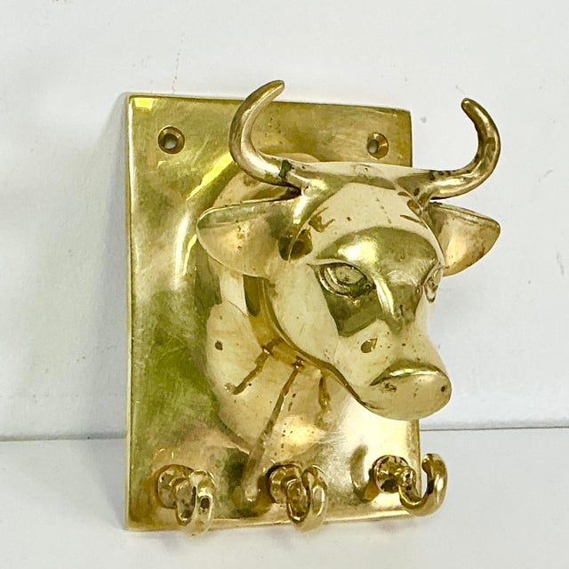 We love this vintage brass wall hook in the shape of a Bull bust. It features three small hooks for keys across the...