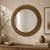 Inspired by classical laurel wreath motifs, this vintage round wall mirror features an exceptionally well-crafted antiqued...