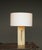 A stylish Italian table lamp with solid travertine base and a brass fitting. Unmarked it is very much in the style of...