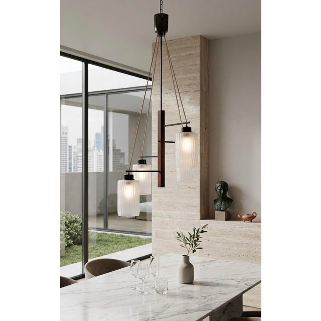 Bring the warm, nostalgic glow of the mid-century era into your home. This exquisite 4 light chandelier isn’t just a...