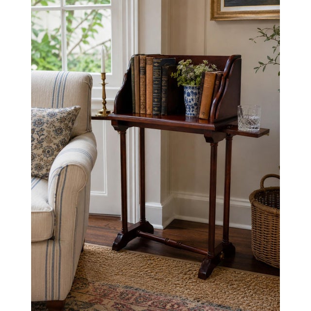 A wonderfully useful late 20th century mahogany book stand inspired by Federal and Georgian library furniture, with shaped...