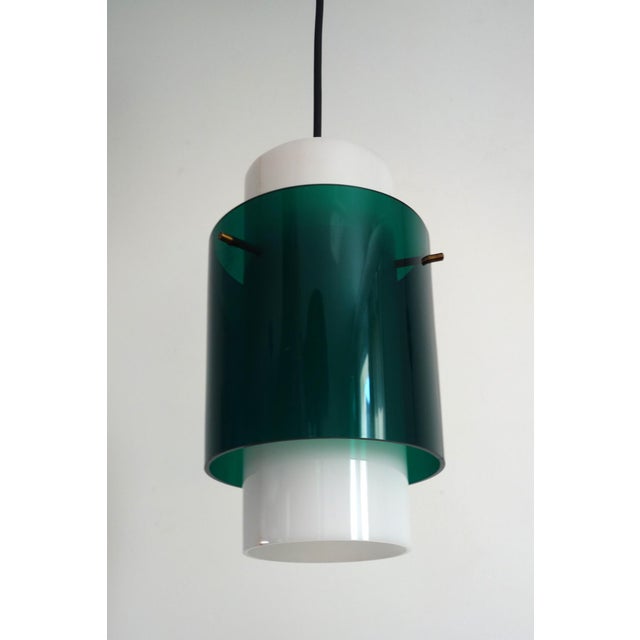 Italian pendant light from the 1950s/60s by Goffredo Reggiani. Two acrylic glass cylinders: one white, the other a wider,...