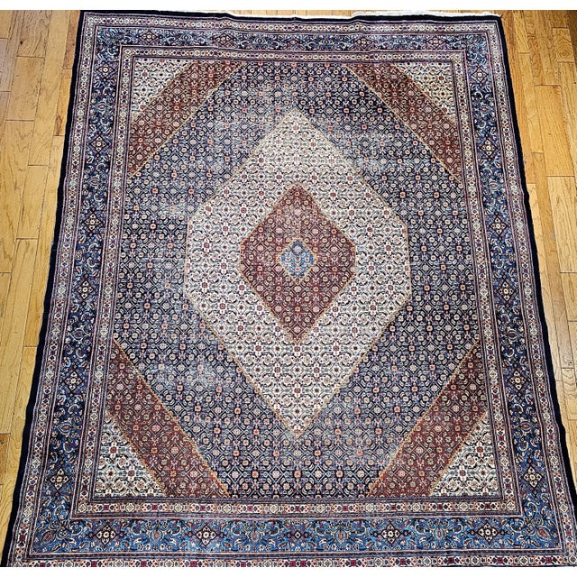 This exquisite vintage Persian Tabriz Mahi rug, masterfully woven by a skilled artisan workshop in Tabriz, Northwest...