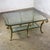 Handsome vintage Hollywood Regency to Neoclassical style monumental sized coffee table composed of a gilded welded steel...