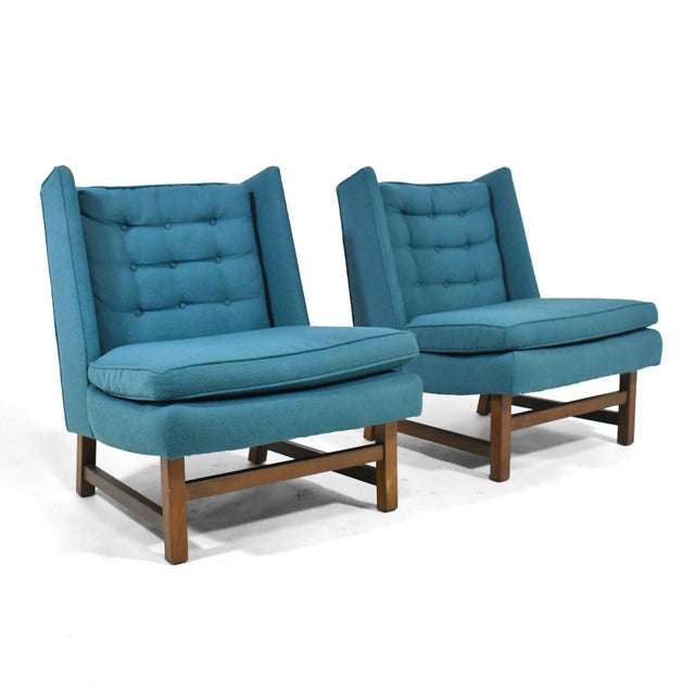 This pair of Edward Wormley easy chairs have a wonderful profile combining a casual slipper chair with a wing-back....