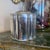 An elegantly shaped silver plate lidded box with smartly beaded rims at the top and bottom and stylized bamboo motifs on...