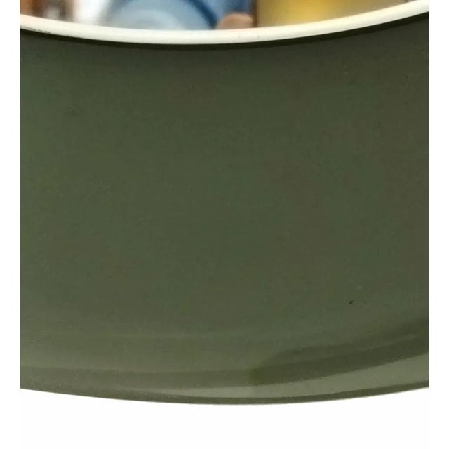 Wall mirror, prod. Cristal Labor Italia circa 1960, green concave shaped glass, mirror glass, wooden suspension. This...