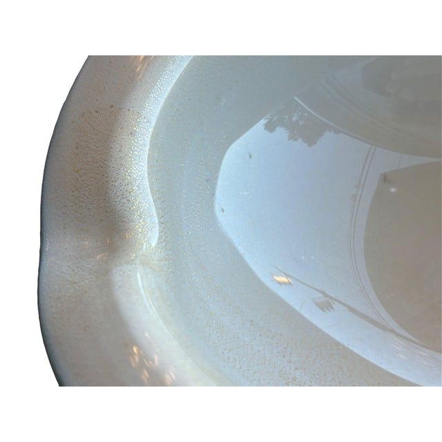 This Alfredo Barbini Murano glass dish features an elegant solid white design accented with delicate specks of 24k gold,...
