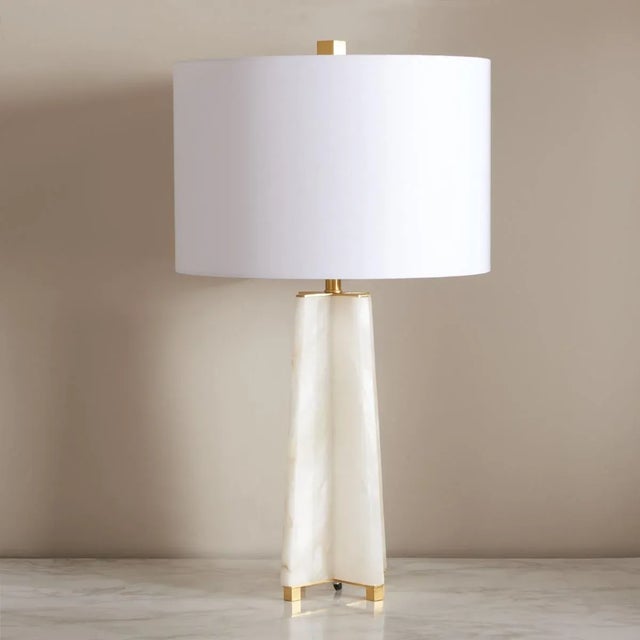 Illuminate your space with the Gracellen Alabaster Table Lamp in a captivating blend of white and gold. This elegant piece...