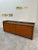 Designed by Afra and Tobia Scarpa for the Artona line by Maxalto, this 1975 sideboard features a walnut frame with a...
