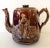 This 1880's Rockingham large teapot was a common place item in an English countryside home. It's treacle glaze runs over...