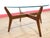 This Mid Century Vintage Teak and Glass Coffee Table embodies true mid century style, showcasing a beautiful is century...