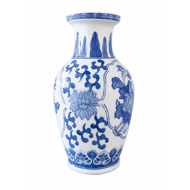 A timeless addition to any blue and white porcelain collection, this vintage Chinese porcelain vase showcases a...