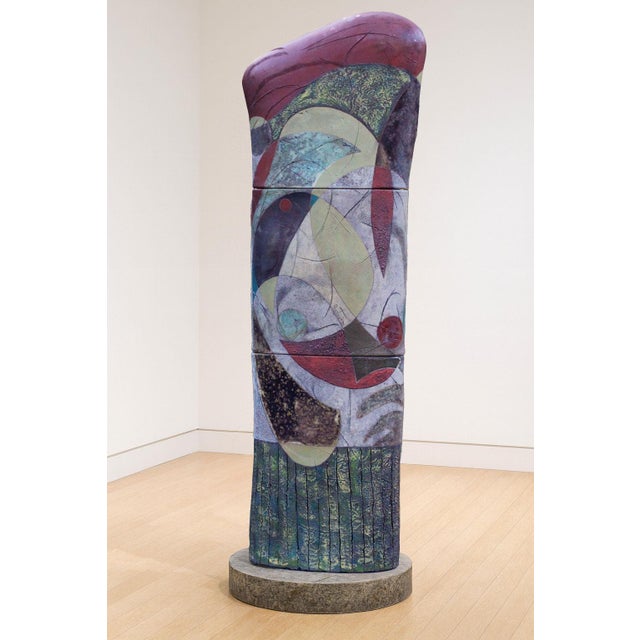 A monumental column standing 80 inches tall, showing Gustavson's work at its most ambitious. Deep jewel tones of purple,...