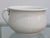 This classic white ironstone chamber pot bowl was produced by Homer Laughlin in the United States, circa 1920s, and...