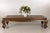 This antique Chinese opium bed has been thoughtfully repurposed as a substantial coffee table, retaining the sculptural...