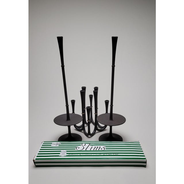 Set of three iron metal candles holders and 10 red candles; includes 1 multi candleabra and 2 tall single candle holders...