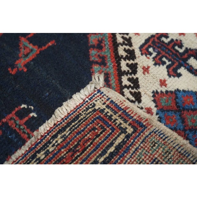 One of our many collectible SE Persian tribal Afshar rugs, this example features a cerulean blue field, centering a coral...