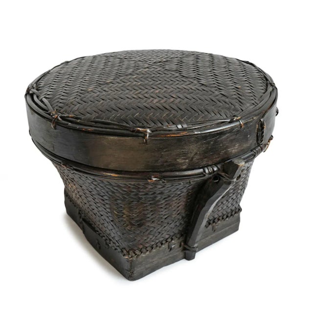Vintage Akha Thai hand woven round basket with lid. Rich dark finish with signs of age and use. Circa mid 20th century....