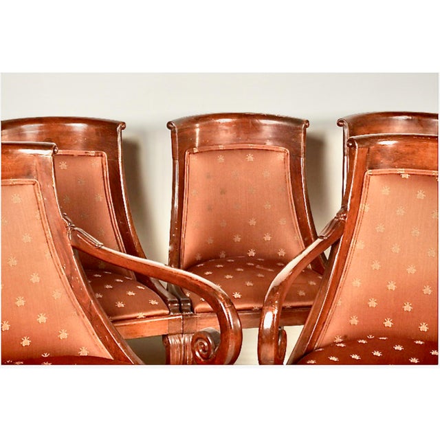 This is a charming set of six carved and inlaid mahogany dining chairs in the French Empire style. The chairs date to the...