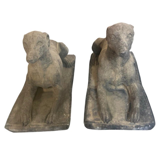 Elevate your outdoor or indoor space with this striking pair of recumbent greyhound statues. Expertly crafted from cast...