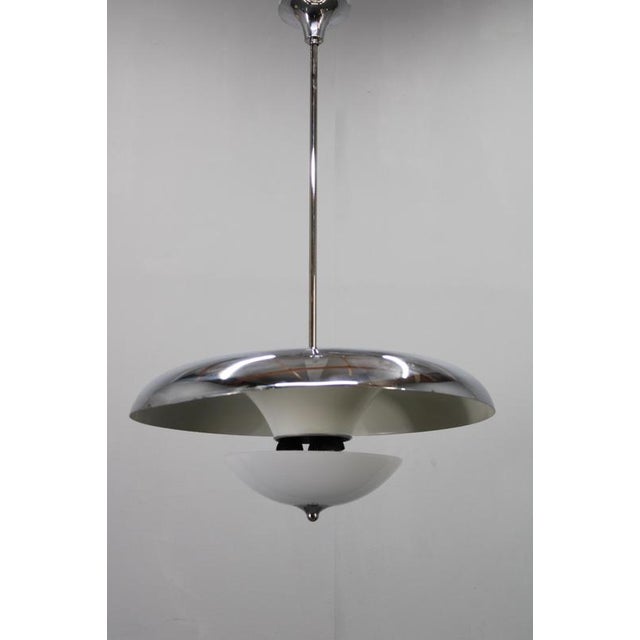 An exceptional art deco chandelier designed and manufactured by napako, czechoslovakia, circa 1930s. This elegant lighting...