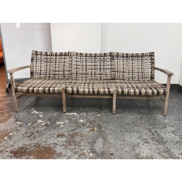 Design Plus Gallery presents the Isola Outdoor Sofa from Frontgate. This three-seat design pairs a teak frame with two-...