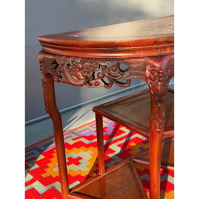 This gorgeous antique Demi-Lune Console showcases remarkable craftsmanship with hand-carved dragons, botanical scrollwork,...