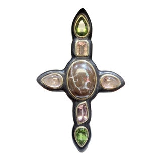 Ebony Cross W/ Boulder Opal, Pear-Shaped Peridots, Pear Shaped Cabochons, Fancy Cut Pink Tourmaline, Peach Tourmaline, 18k Yellow Gold. For Sale