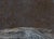 Powder Basin features a textured landscape created with oil and dirt on paper, evoking a sense of raw, earthy beauty. The...