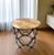 Add rustic-industrial charm to your space with this pair of round side tables, featuring solid mango wood tops and sturdy...