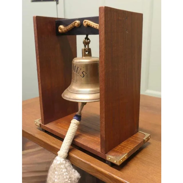Mounted bronze ships bell from mv erimus 1922, thornaby on tees bronze ships bell with purpose made mounting bracket from...