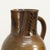 This beautiful earthenware jug dates from the 19th century and is handmade, decorated with delicate motifs that subtly...