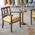 Incredible carved wood chair from France, 1940s. Beautiful carved bobbin wood legs and criss-cross detailing on back. Dark...