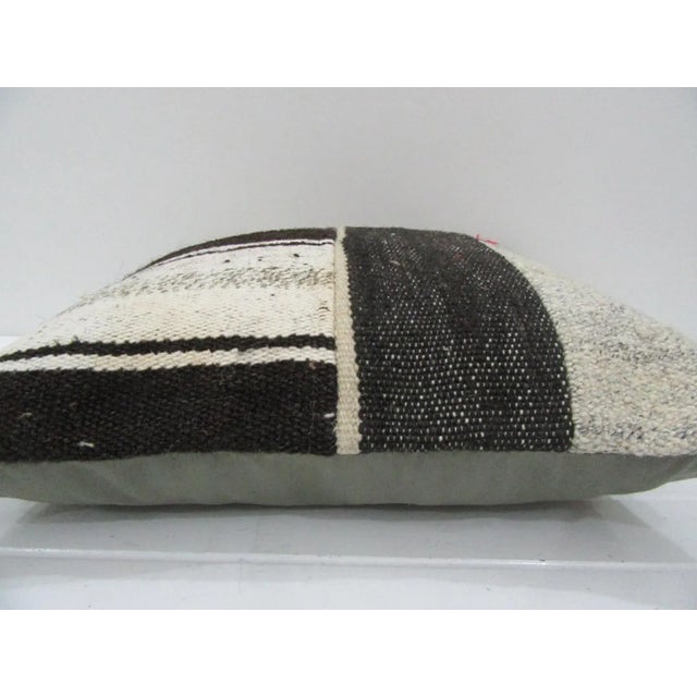 This is a pillow cover made from a vintage kilim rug. The piece was properly washed and ready to use. Pillow inserts not...