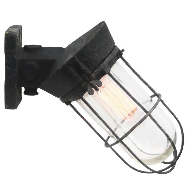 Dutch industrial wall lamp made by ‘industria rotterdam’ black cast iron with clear glass e27 / e26 this piece has an...
