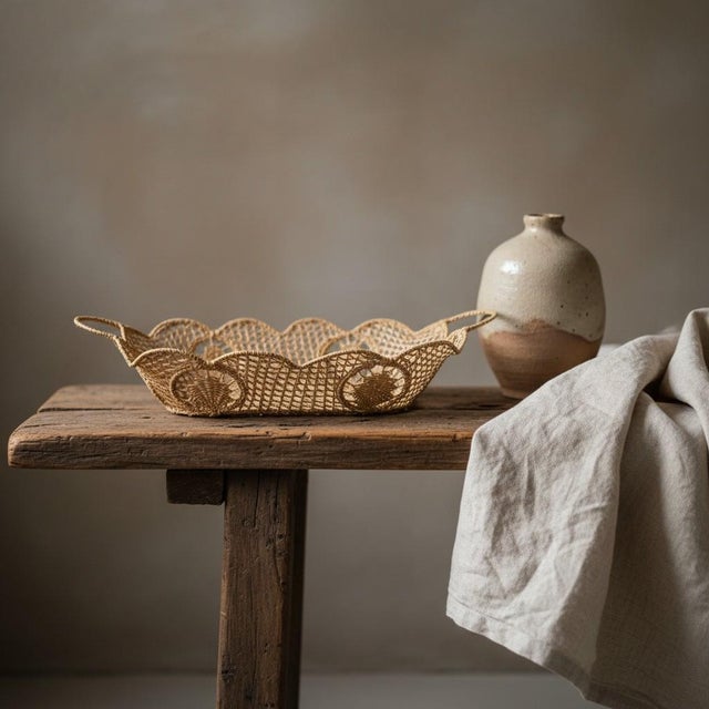Handwoven from sustainably harvested iraca palm, this artisan basket showcases the intricate openwork weaving that has...